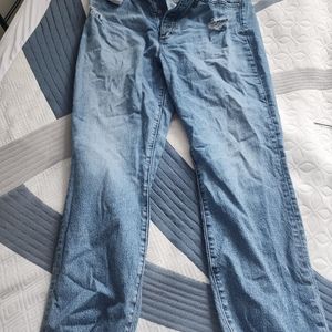 Silver button fly distressed jeans